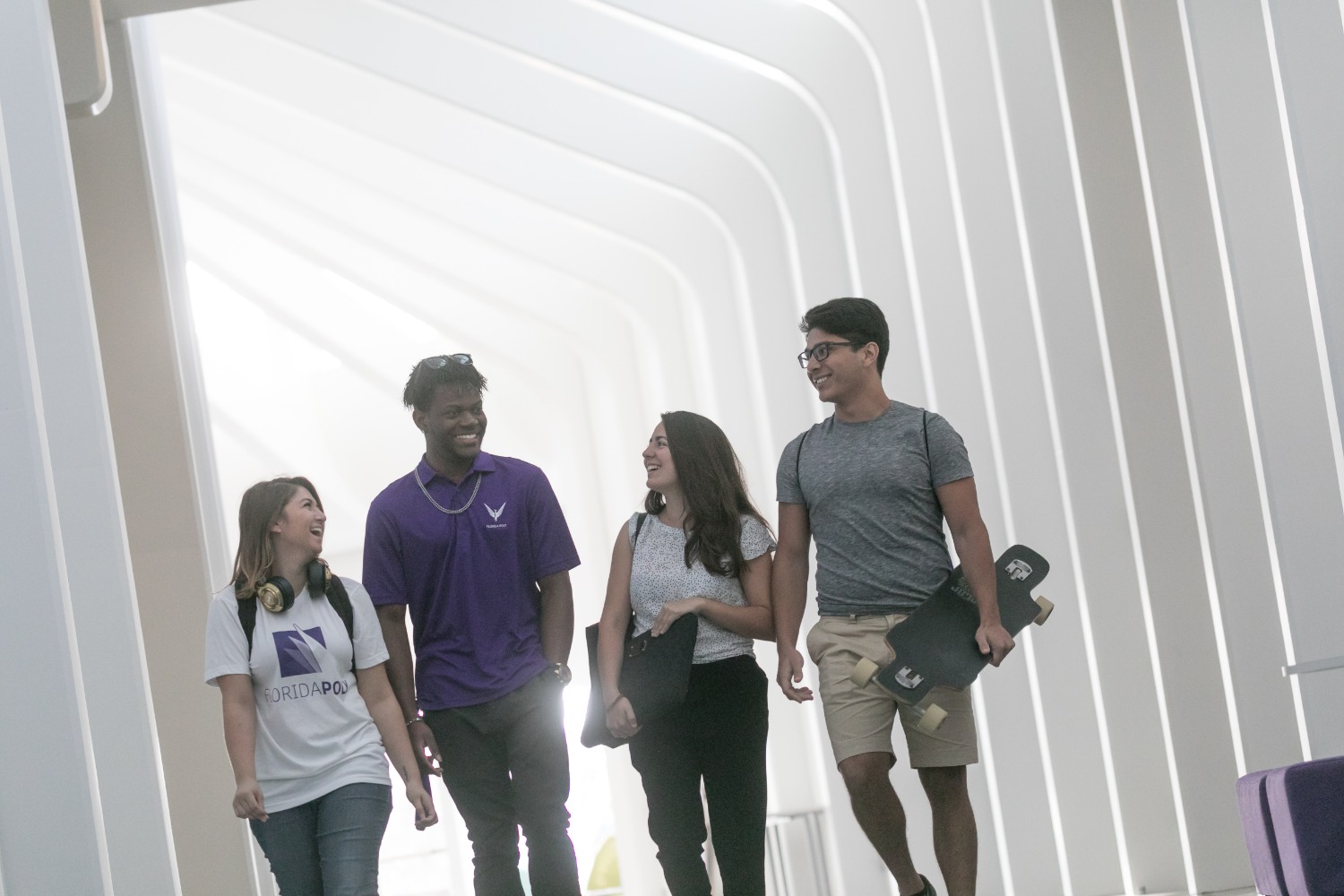 Students walking together in the IST Building.