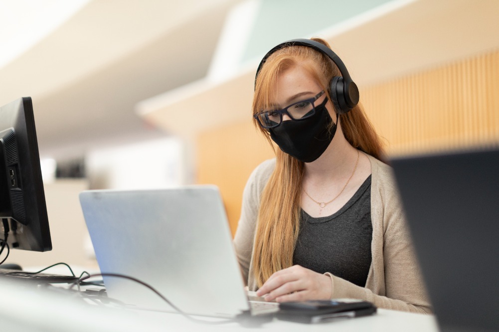 A student working on her computer.