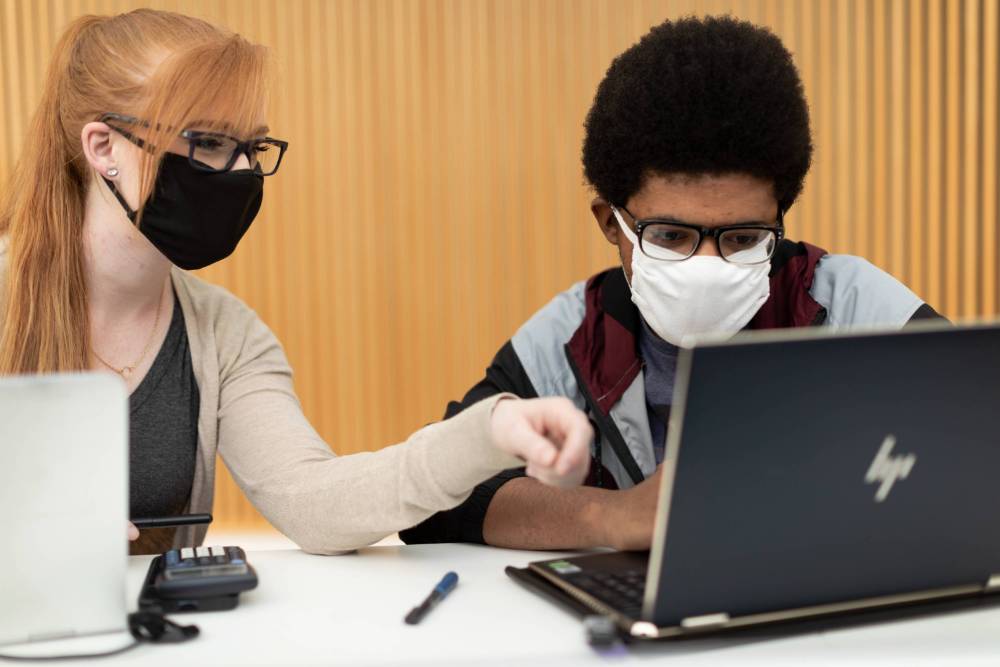 Students working at a computer.