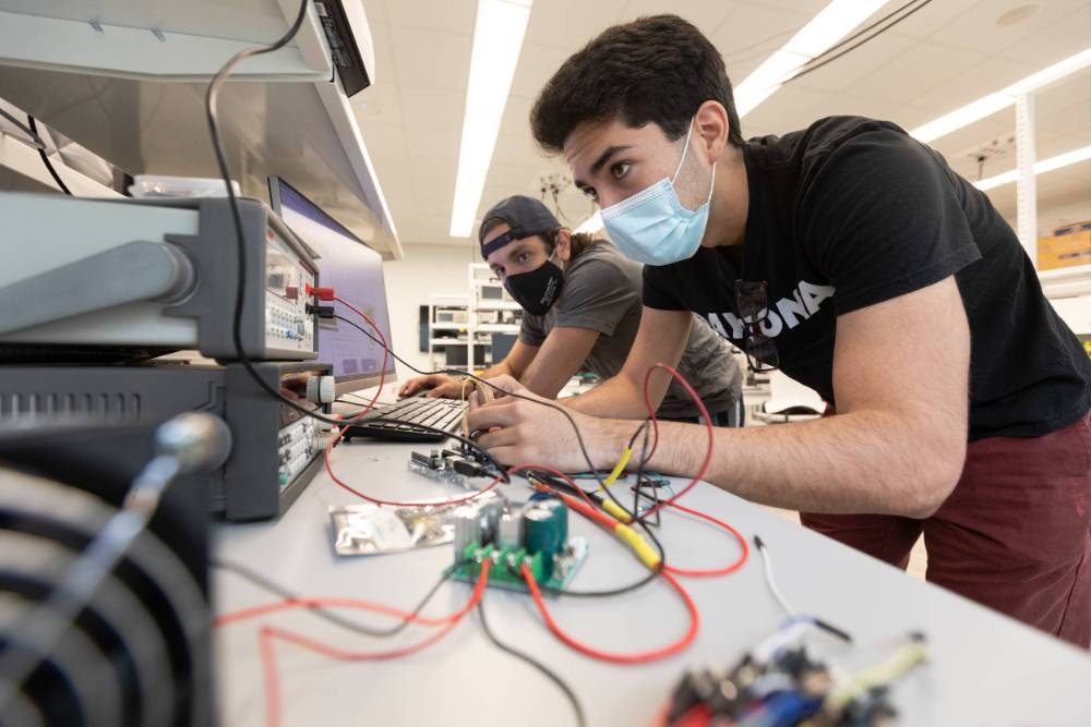 Students working on an electrical project.