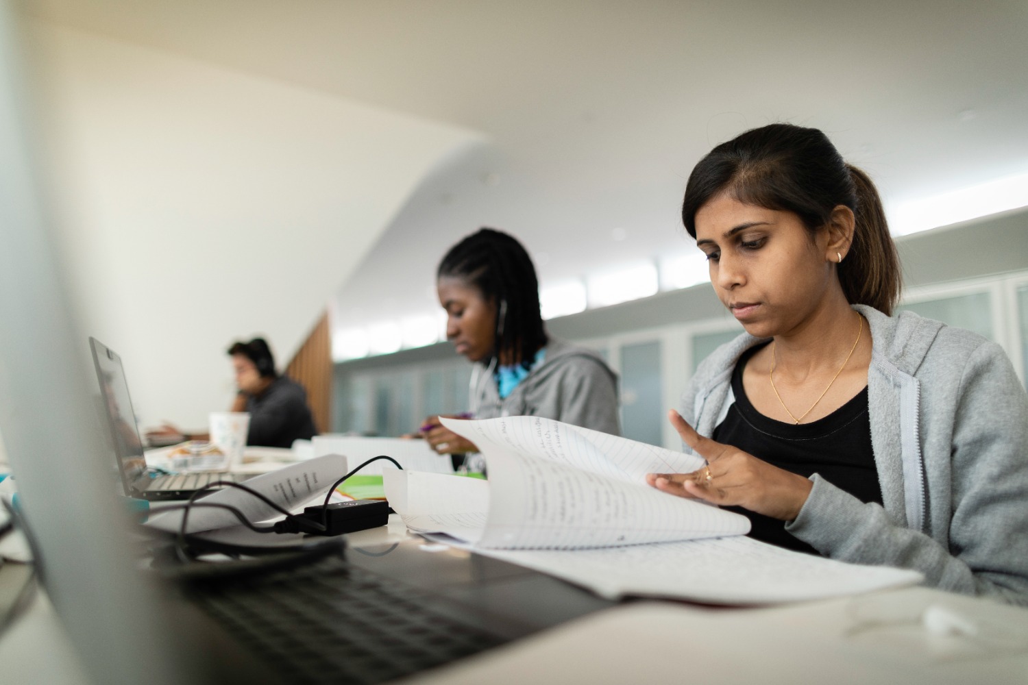 Students studying together at a table.